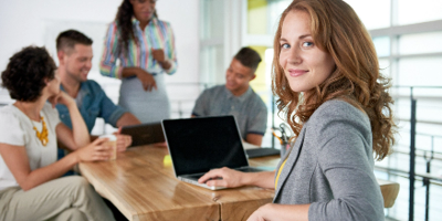 Group Office Meeting with Smiling Woman