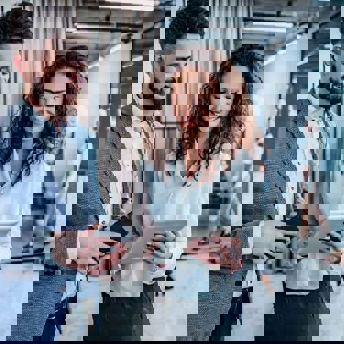 Man Woman Looking At Tablet