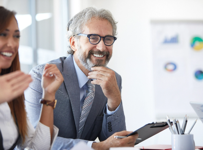 Smiling man with clipboard